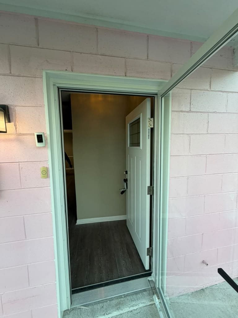 New exterior entry door with white casing
