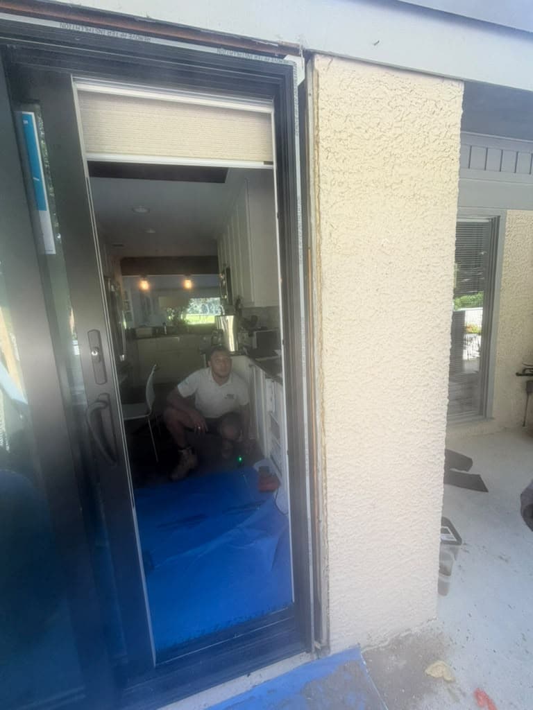 Sliding patio door during installation with floor protection